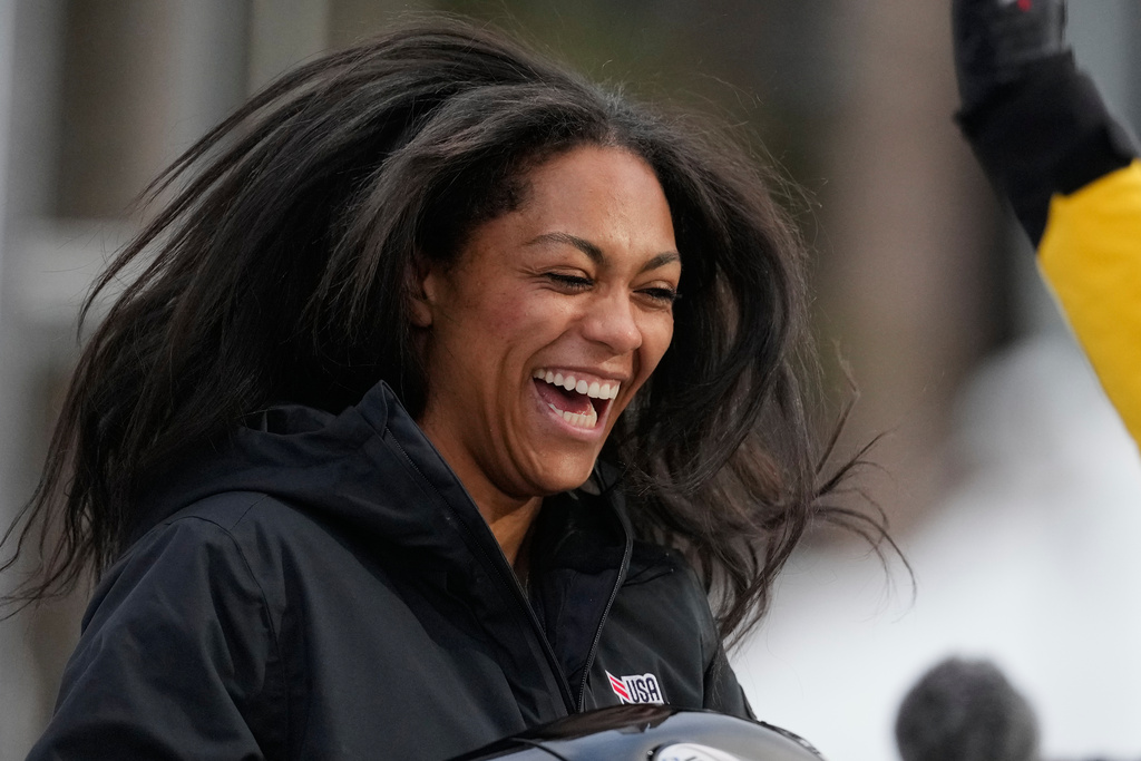 Winner Kaysha Love of the United States celebrates after the women's monobob race at the Bobsleigh World Cup in Innsbruck, Austria, Saturday, Nov. 29, 2025. (AP Photo/Matthias Schrader)