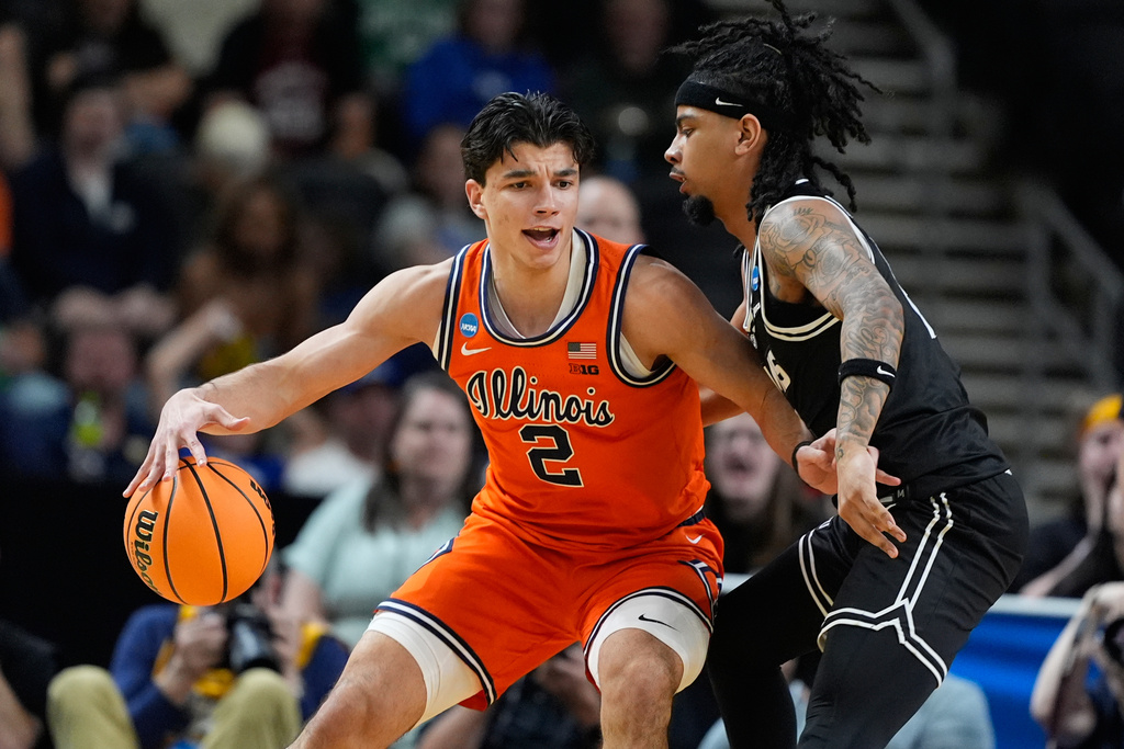 Illinois guard Andrej Stojakovic (2) dribbles against Virginia Commonwealth guard Terrence Hill Jr. (6) during the first half in the second round of the NCAA college basketball tournament, Saturday, March 21, 2026, in Greenville, S.C. (AP Photo/Brynn Anderson)