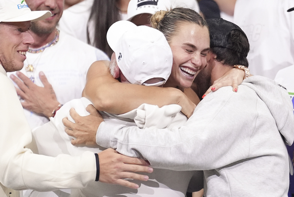 Aryna Sabalenka, of Belarus, hugs supporters after defeating Amanda Anisimova, of the United States, during the women's singles final of the U.S. Open tennis championships, Saturday, Sept. 6, 2025, in New York. (AP Photo/Frank Franklin II)