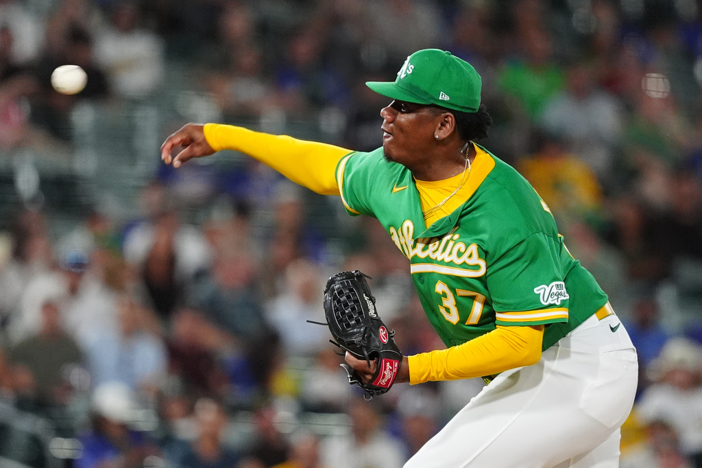 Athletics pitcher Elvis Alvarado throws in the ninth inning of a baseball game against the Minnesota Twins Wednesday, Aug. 26, 2026, in West Sacramento, Calif. (AP Photo/Alan Greth)