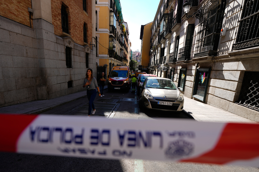 Police tape is placed near the scene of a building collapse in Madrid, Spain, on Tuesday, Oct. 7, 2025. (AP Photo/Manu Fernandez)