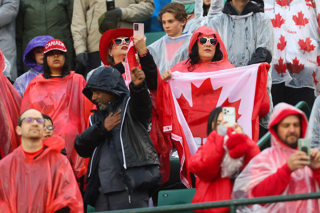 Fans brave the rain for Canada's international friendly soccer match against Uzbekistan during the first half in Edmonton, Alberta, Monday, June 1, 2026. (Codie McLachlan/The Canadian Press via AP)