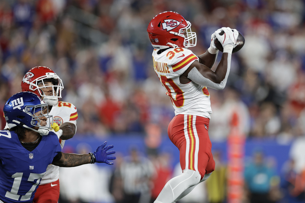 Kansas City Chiefs cornerback Chris Roland-Wallace (30) intercepts a pass intended for New York Giants wide receiver Wan'Dale Robinson (17) as Chiefs cornerback Trent McDuffie watches during the first half of an NFL football game Sunday, Sept. 21, 2025, in East Rutherford, N.J. (AP Photo/Adam Hunger)