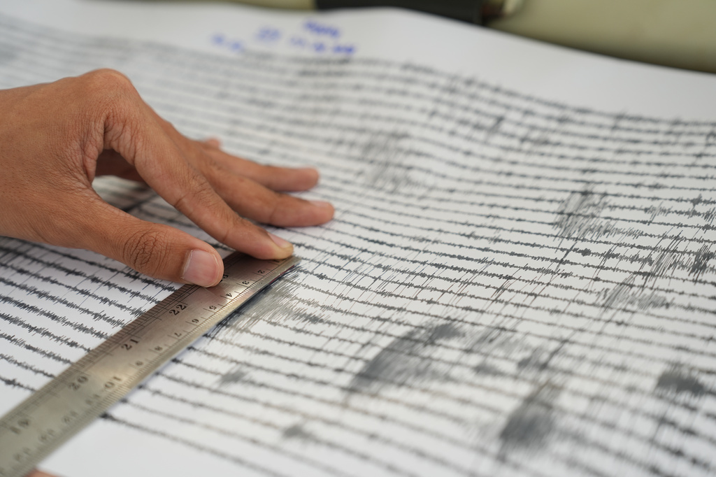 A technician measures the seismic readings from the eruption of Mount Anak Krakatau at an observation post in Pasauran, Banten province, Indonesia, Monday, Sept. 7, 2026. (AP Photo/Dziki Oktomauliyadi)
