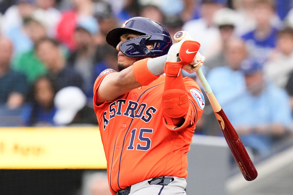 Houston Astros' Isaac Paredes (15) hits an RBI double against the Toronto Blue Jays during the first inning of a baseball game in Toronto on Wednesday, June 24, 2026. (Chris Young/The Canadian Press via AP)