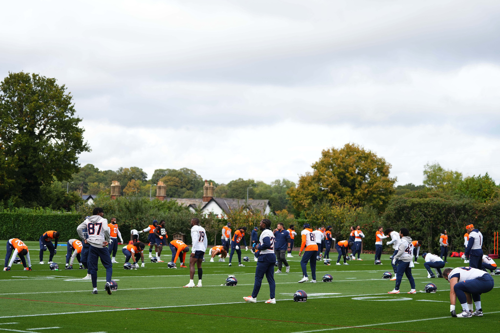 Denver Broncos take part in a NFL training session at Tottenham Hotspur training ground in London, Wednesday, Oct. 8, 2025. (AP Photo/Kirsty Wigglesworth)