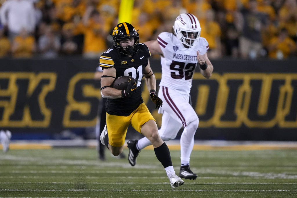 Iowa's Kaden Wetjen (21) returns a punt for a touchdown during the second half of an NCAA college football game against Massachusetts, Saturday, Sept. 13, 2025, in Iowa City, Iowa. (AP Photo/Charlie Neibergall)