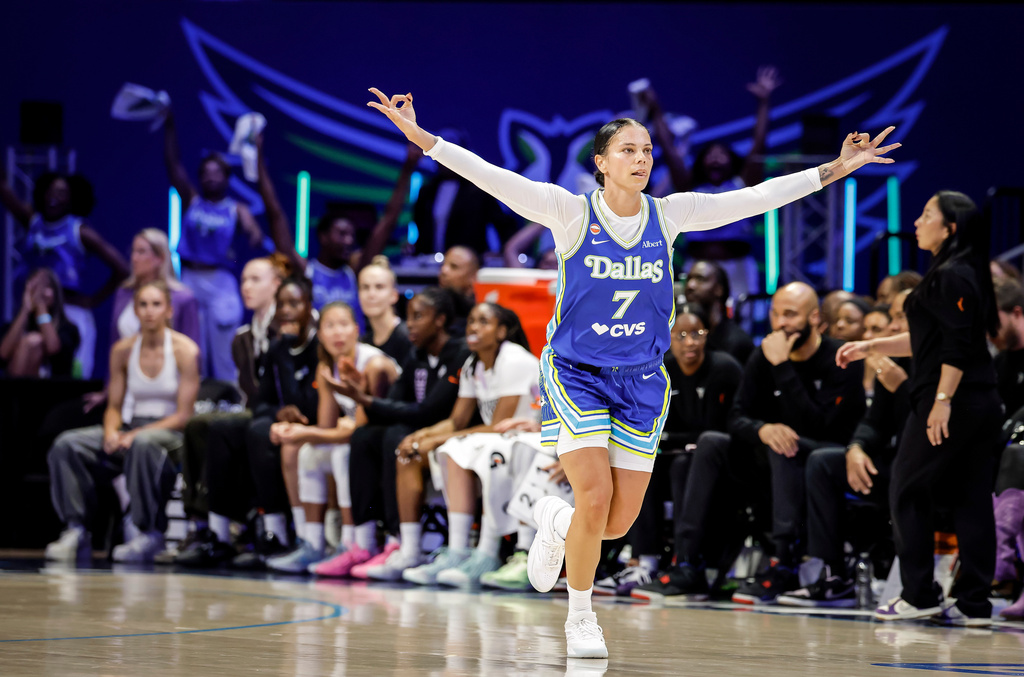 Alysha Clark (7) celebrates a 3-point basket in the first half as the Golden State Valkyries play the Dallas Wings in Game 2 of the WNBA playoffs first round in Arlington, Texas, on Wednesday, Sept. 30, 2026. (Carlos Avila Gonzalez/San Francisco Chronicle via AP)