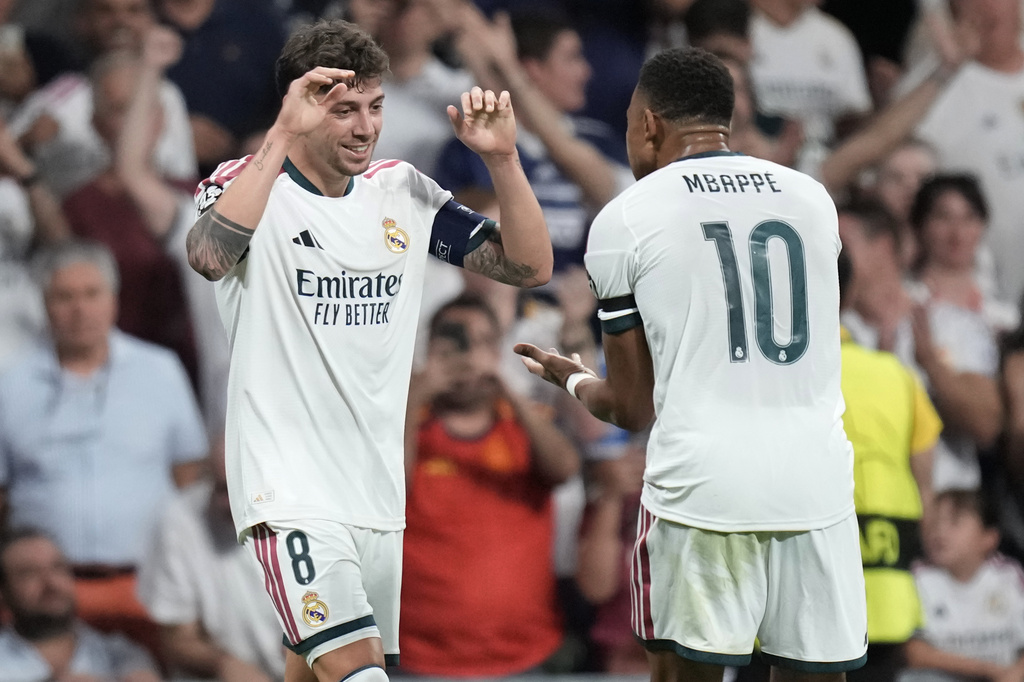 Real Madrid's Federico Valverde celebrates with Kylian Mbappe scoring his side's second goal during a Champions League soccer match between Real Madrid and Inter Milan in Madrid, Spain, Tuesday, Sept. 8, 2026. (AP Photo/Bernat Armangue)
