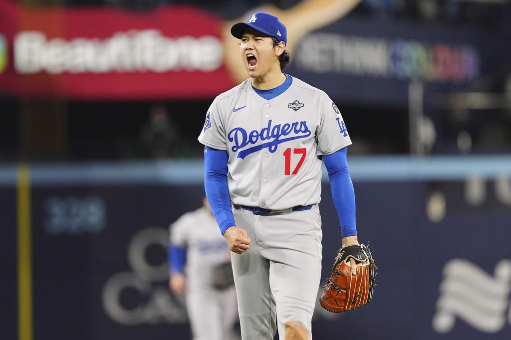 Los Angeles Dodgers pitcher Shohei Ohtani (17) celebrates after striking out Toronto Blue Jays' Andrés Giménez with the bases loaded to end the second inning in Game 7 of baseball's World Series in Toronto on Saturday, Nov. 1, 2025. (Frank Gunn/The Canadian Press via AP)