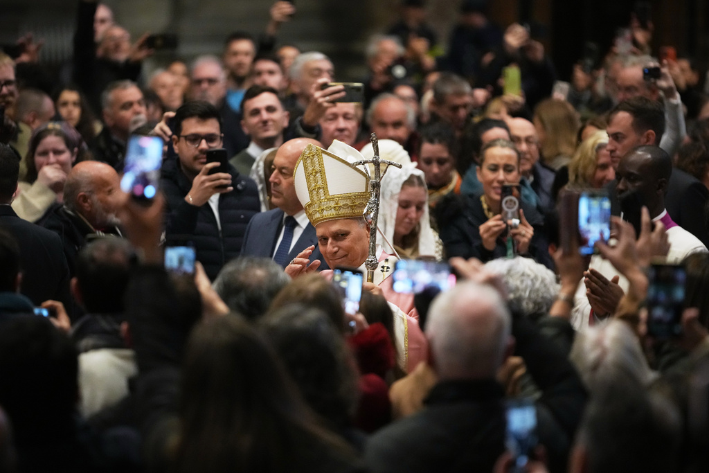 Pope Leo XIV arrives to celebrate a Mass on the occasion of the Jubilee of Prisoners in St. Peter's Basilica, at the Vatican, Sunday, Dec. 14, 2025. (AP Photo/Alessandra Tarantino)