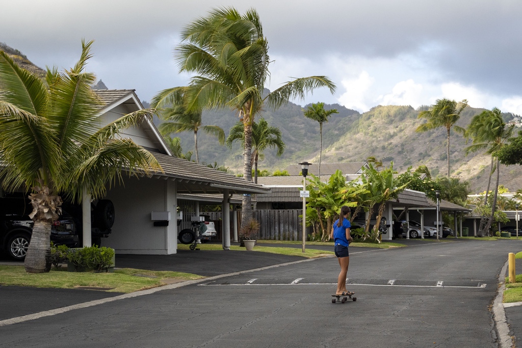 Kapua Ong skateboards near her home in Honolulu, on Thursday, Sept. 11, 2025. (AP Photo/Mengshin Lin)