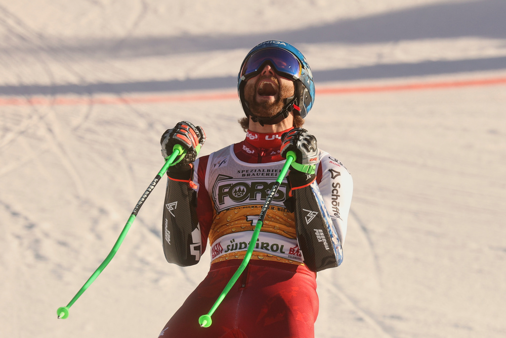 Austria's Marco Schwarz celebrates at the finish area of an alpine ski, men's World Cup Giant slalom, in Alta Badia, Italy, Sunday Dec. 21, 2025. (AP Photo/Alessandro Trovati)