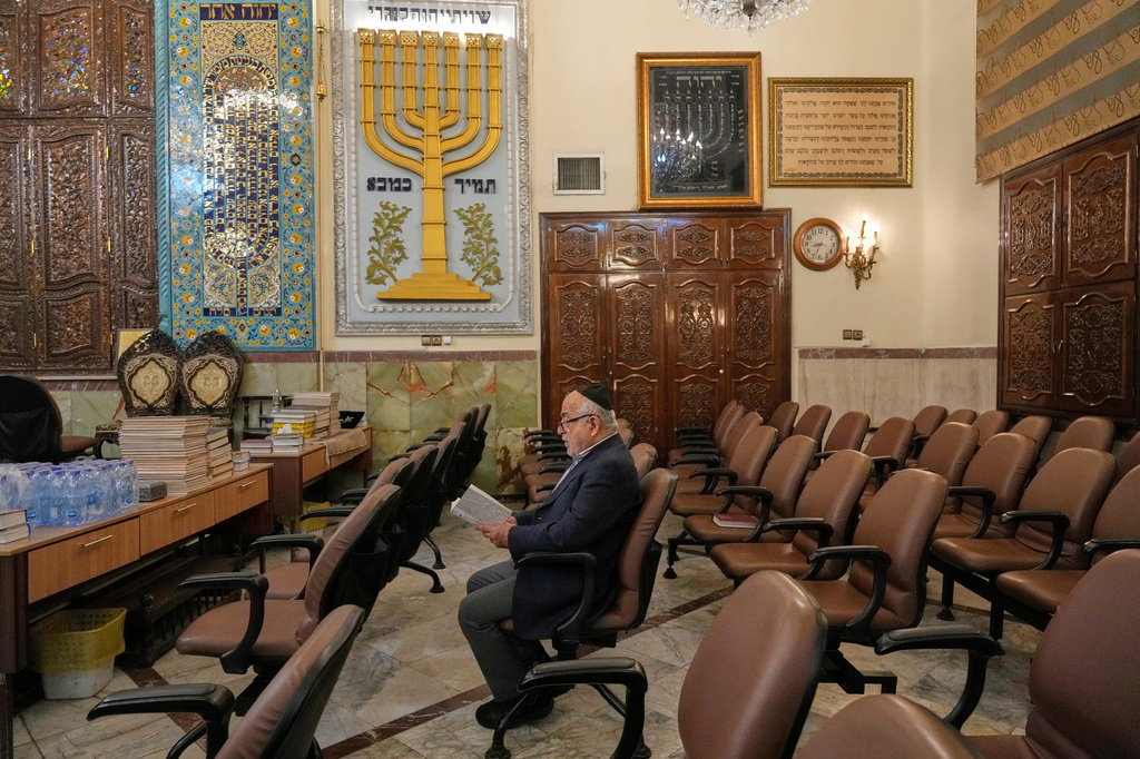 An Iranian Jewish man prays in a memorial for the slain Iranian Supreme Leader Ayatollah Ali Khamenei and other victims, who were killed in the U.S. and Israel strikes, at Yousefabad Synagogue, in Tehran, Iran, Thursday, April 16, 2026. (AP Photo/Vahid Salemi)
