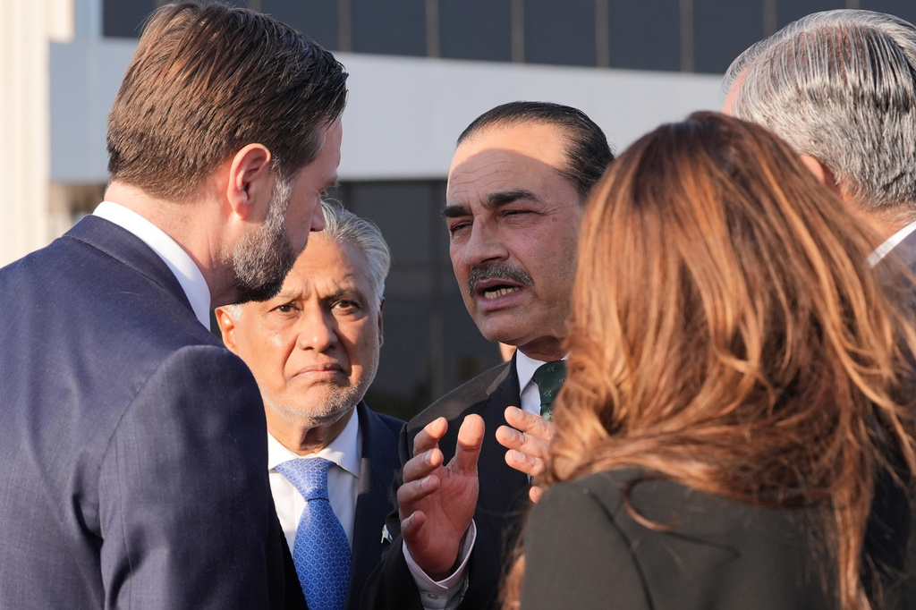 Vice President JD Vance, left, talks to Pakistan's Chief of Defence Forces and Chief of Army Staff Field Marshall Asim Munir, right, and Pakistani Deputy Prime Minister and Foreign Minister Mohammad Ishaq Dar, center, before boarding Air Force Two after attending talks on Iran in Islamabad, Pakistan, Sunday, April 12, 2026. (AP Photo/Jacquelyn Martin, Pool)