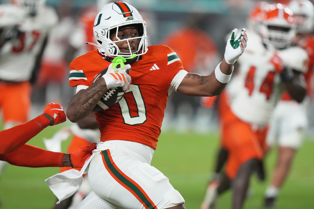 Miami running back Girard Pringle Jr. (0) runs during the first half of an NCAA college football game against Florida A&M, Thursday, Sept. 10, 2026, in Miami Gardens, Fla. (AP Photo/Lynne Sladky)