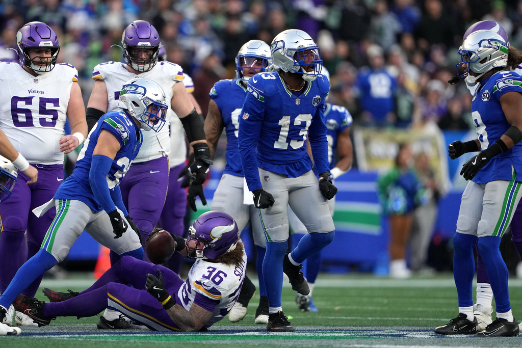 Seattle Seahawks linebacker Ernest Jones IV (13) reacts after tackling Minnesota Vikings running back Zavier Scott (36) during the second half of an NFL football game, Sunday, Nov. 30, 2025, in Seattle. (AP Photo/Lindsey Wasson)