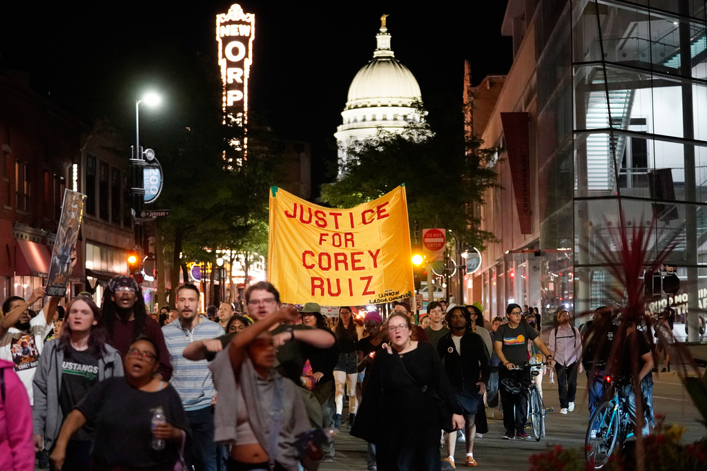 Protesters march past the Capitol, Thursday, July 23, 2026, in Madison, Wis., after a Madison police officer shot and killed Corey Durell Ruiz on Wednesday. (AP Photo/Kayla Wolf)