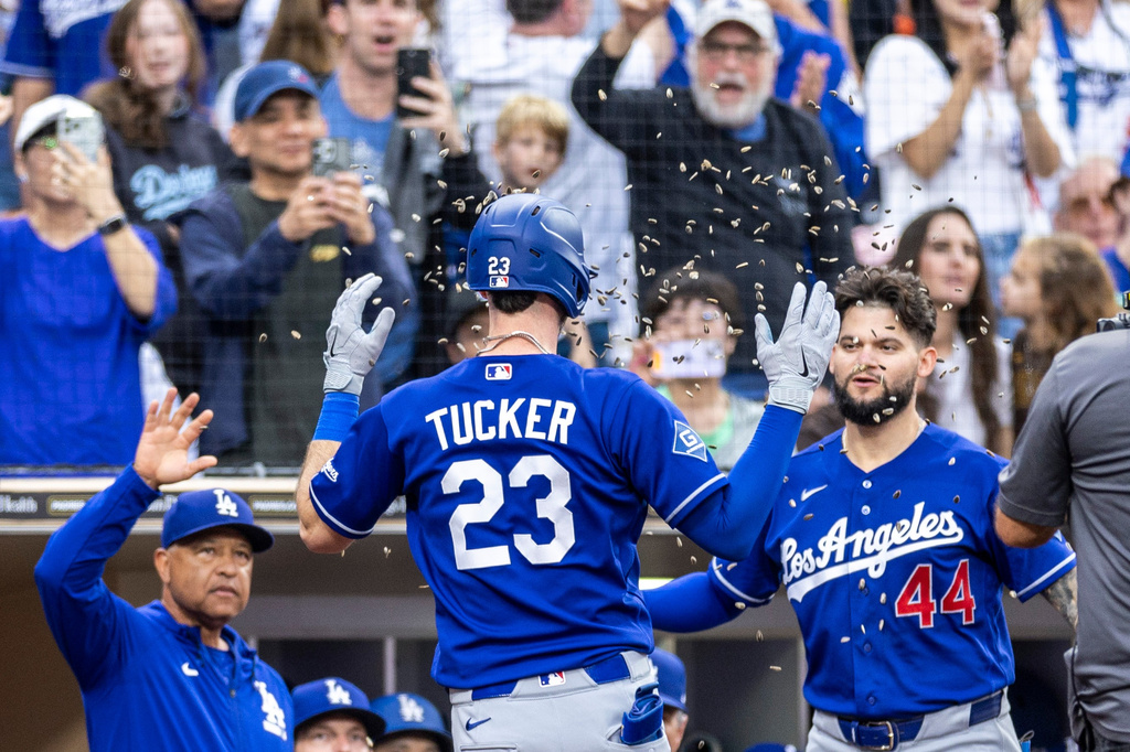 Los Angeles Dodgers' Kyle Tucker (23) celebrates after his two-run home run with Andy Pages (44) in the sixth inning of a baseball game against the San Diego Padres, Saturday, June 27, 2026, in San Diego. (AP Photo/Tony Ding)