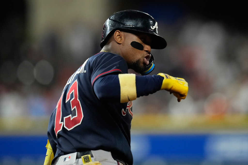 Atlanta Braves' Ronald Acuña Jr. celebrates as he runs the bases after hitting a grand slam during the seventh inning of a baseball game against the Houston Astros in Houston, Saturday, Sept. 19, 2026. (AP Photo/Ashley Landis)