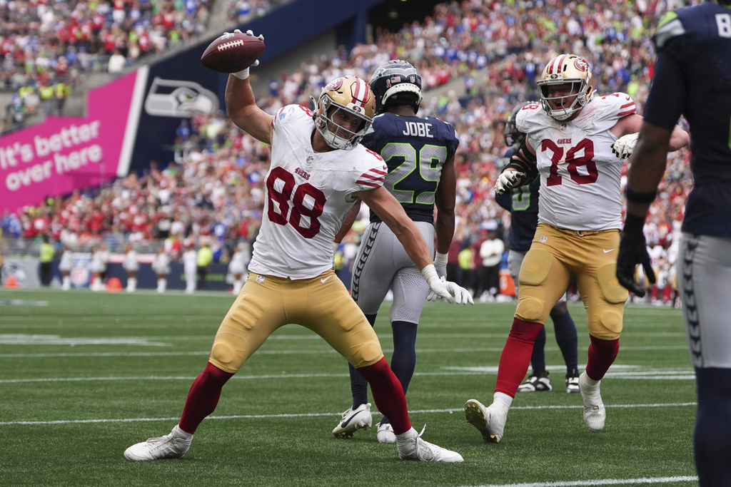 San Francisco 49ers tight end Jake Tonges (88) reacts after a touchdown during the second half of an NFL football game against the Seattle Seahawks, Sunday, Sept. 7, 2025, in Seattle. (AP Photo/Lindsey Wasson)