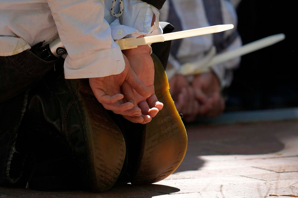 FILE - Protesters are cuffed after being detained on the campus of Emory University during a pro-Palestinian demonstration on April 25, 2024, in Atlanta. (AP Photo/Mike Stewart, File)