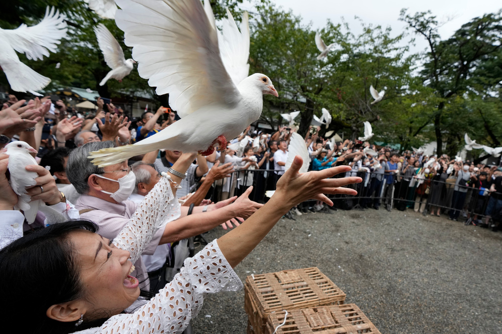 FILE - Doves are released in prayer of peace by worshippers at the Yasukuni Shrine in Tokyo, Japan, Tuesday, Aug. 15, 2023. (AP Photo/Eugene Hoshiko, File)