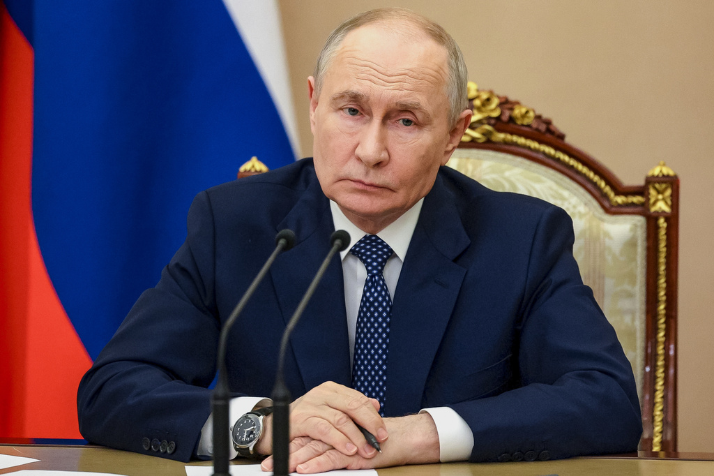 Russian President Vladimir Putin chairs a meeting on measures to support relatives of those killed and injured in the attack on a college in Starobilsk, of the Russia-controlled Luhansk region of Ukraine, at the Kremlin in Moscow, Monday, June 1, 2026. (Vyacheslav Prokofyev/Sputnik, Kremlin Pool Photo via AP)