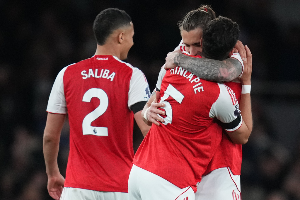 Arsenal's Riccardo Calafiori hugs Piero Hincapie after a Premier League soccer match between Arsenal and Burnley in London, Monday, May 18, 2026. (AP Photo/Kirsty Wigglesworth)