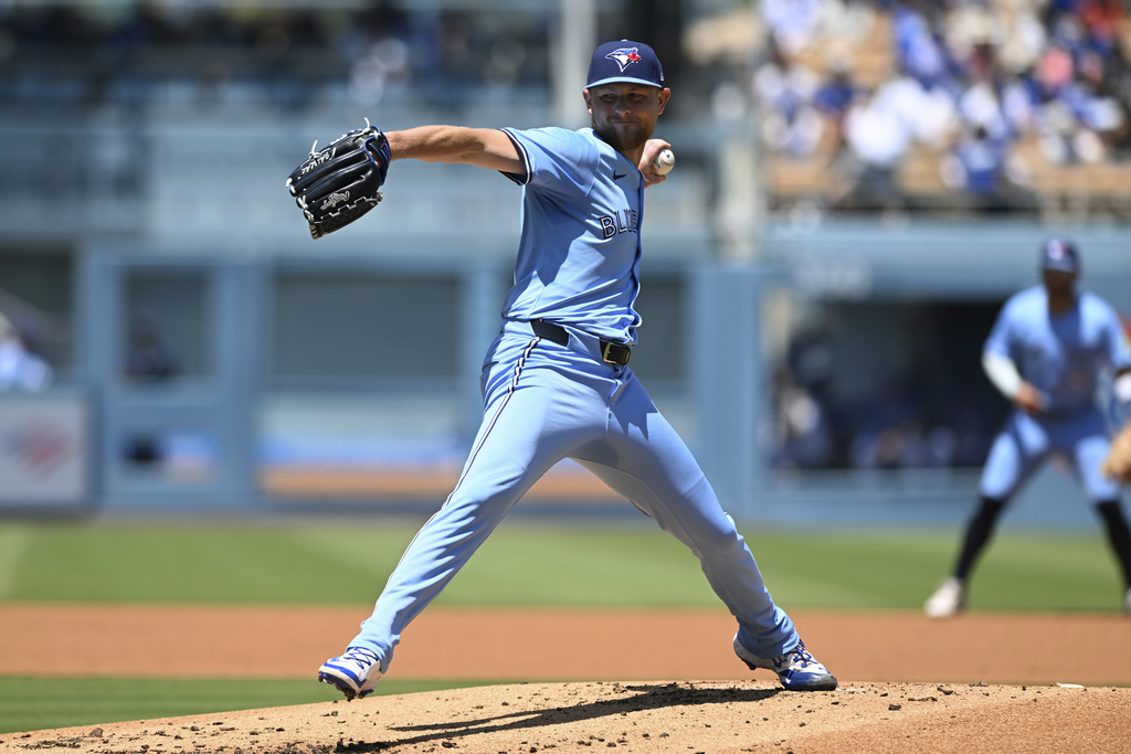 Toronto Blue Jays pitcher Eric Lauer (56) throws a pitch against the Los Angeles Dodgers during the first inning of a baseball game, Sunday, Aug. 10, 2025, in Los Angeles. (AP Photo/Wally Skalij)