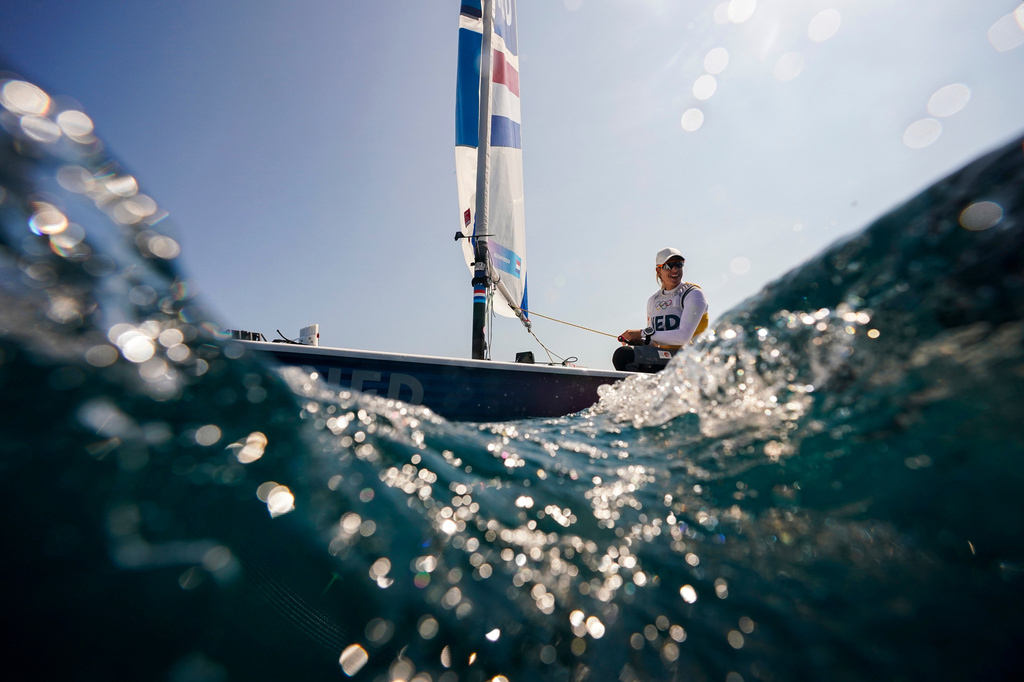 FILE - Marit Bouwmeester, of the Netherlands, sails back to the harbor after ILCA 6 dinghy class final race was postponed during the 2024 Summer Olympics, Aug. 6, 2024, in Marseille, France. (AP Photo/Jacquelyn Martin, File)