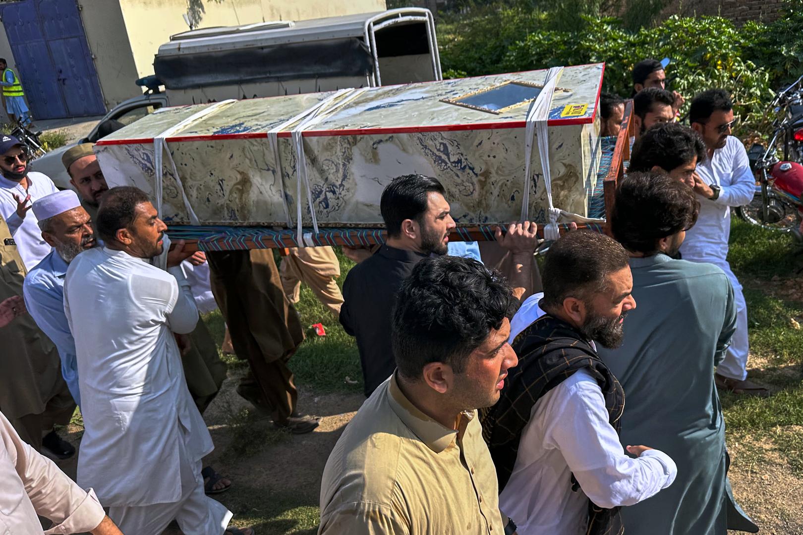 Pakistani security forces ended a 20-hour standoff at a Kohat police compound Saturday after a suicide bombing and gun attack killed 21 people and wounded 103, with suspicion falling on the Pakistani Taliban. (AP Video shot: Maaz Awan)