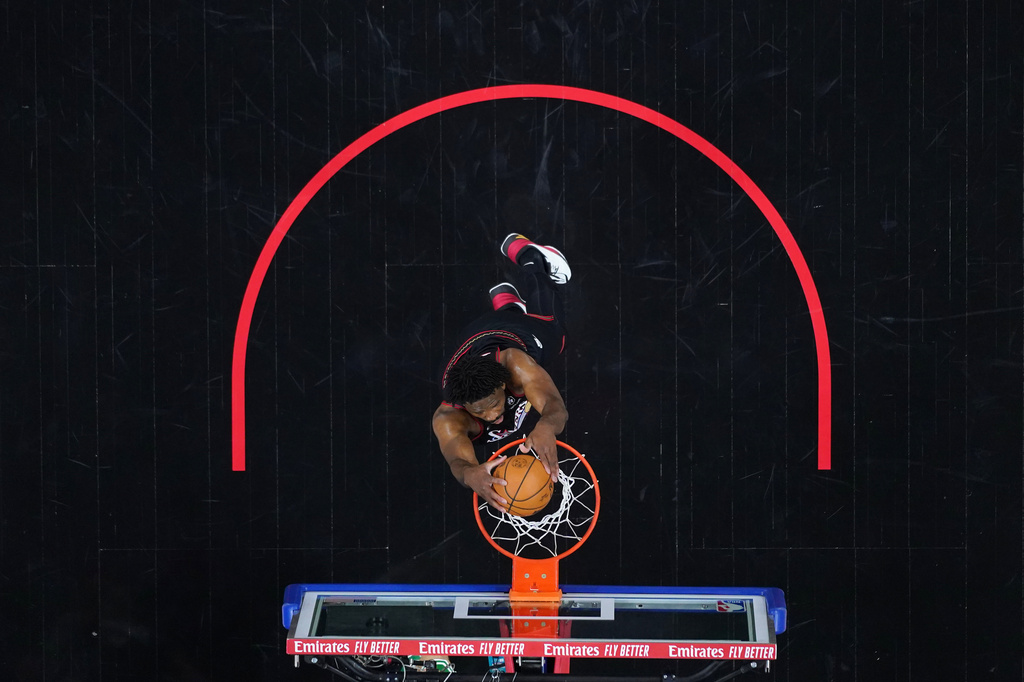 Philadelphia 76ers' Joel Embiid goes up for a dunk during the first half of Game 4 against the Boston Celtics in a first-round NBA basketball playoffs series Sunday, April 26, 2026, in Philadelphia. (AP Photo/Matt Slocum)