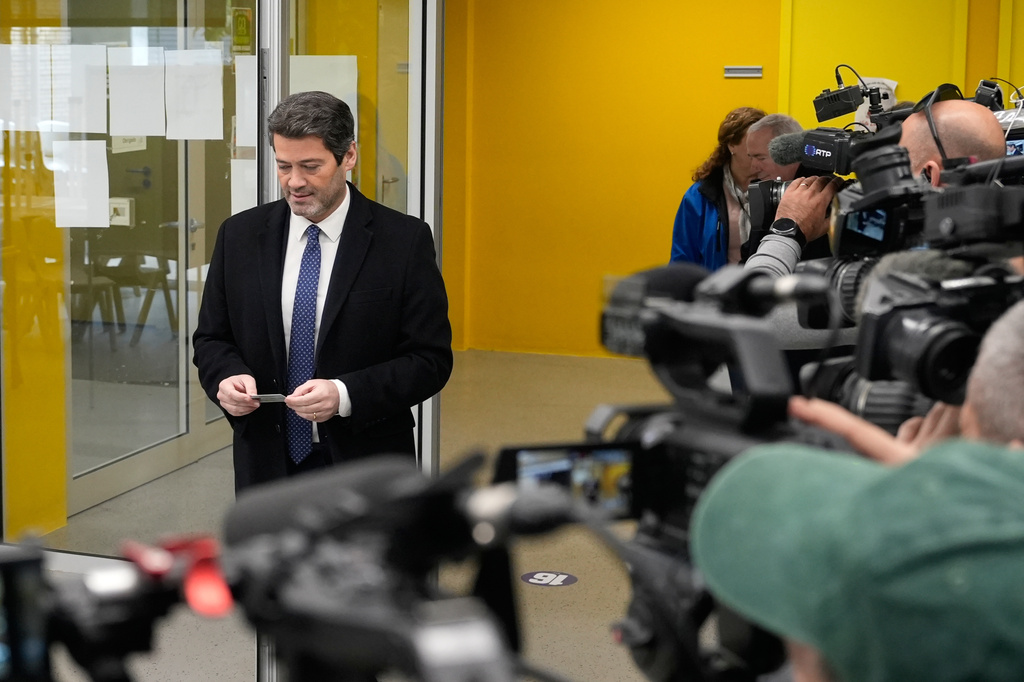 Presidential candidate Andre Ventura, of the populist Chega party, arrives at a polling station before voting in Portugal's presidential election in Lisbon, Sunday, Feb. 8, 2026. (AP Photo/Ana Brigida)