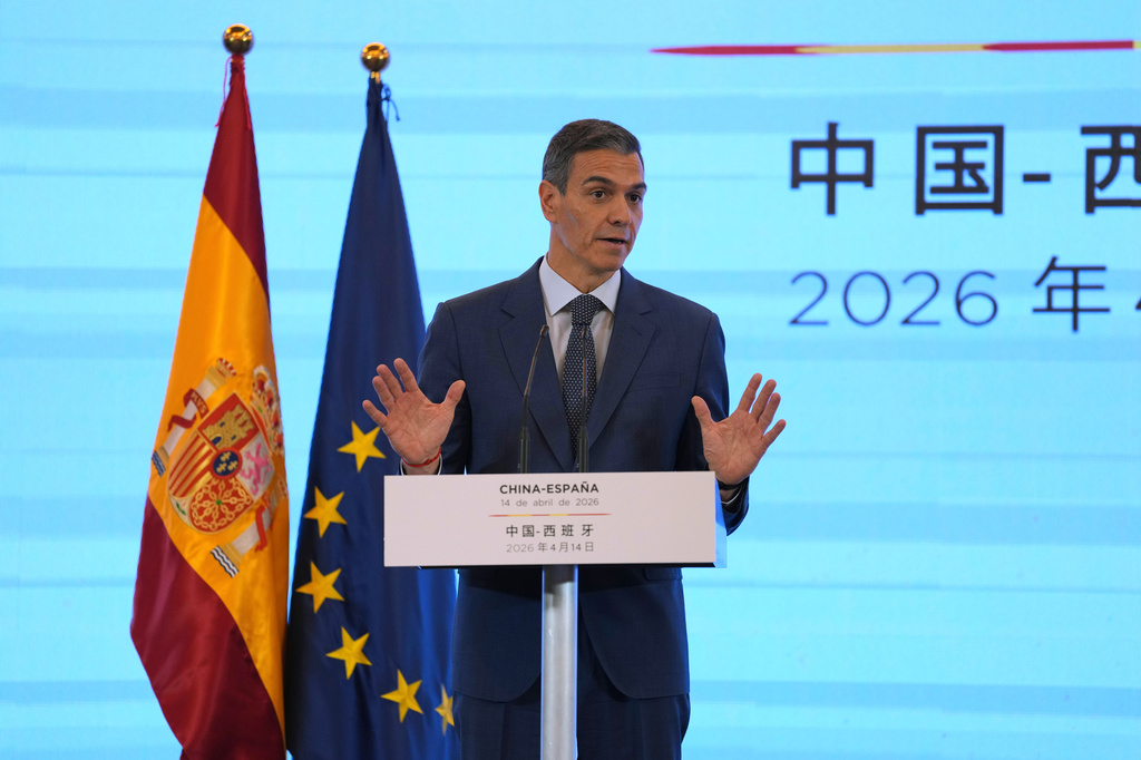 Spain's Prime Minister Pedro Sanchez gestures as he speaks during a press conference in Beijing, China, Tuesday, April 14, 2026. (AP Photo/Ng Han Guan)