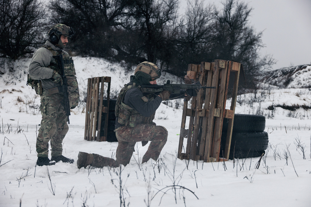 Soldiers from Ukraine's Khartia brigade practice shooting at a training ground in the Kharkiv region, Ukraine, Feb. 14, 2026. (AP Photo/Nikoletta Stoyanova)