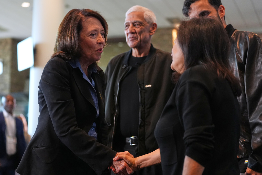 Sen. Maria Cantwell, D-Wash., at left, greets Seattle Seahawks owners the Khosla family, including Controlling Owner & President of the Seahawks Charitable Foundation Neeru Khosla, front right, after a news conference before an NFL football game between the Seahawks and the New England Patriots, Wednesday, Sept. 9, 2026, in Seattle. (AP Photo/Lindsey Wasson)