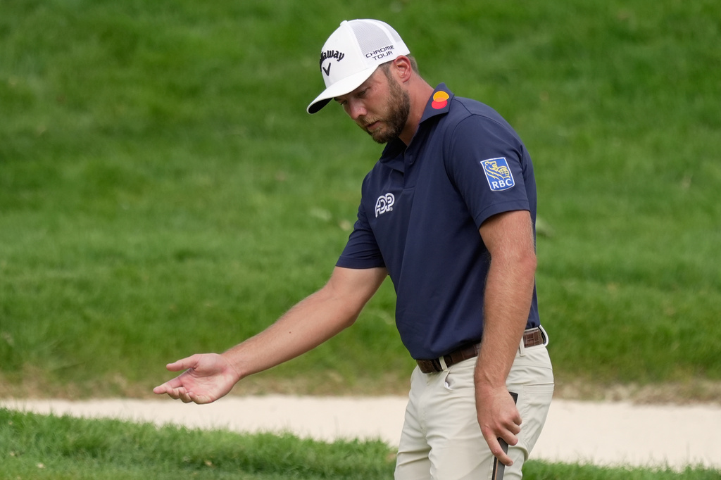 Sam Burns gestures after his first putt on the fifth green during the third round of the Memorial golf tournament, in Dublin, Ohio, Saturday, June 6, 2026. (AP Photo/Sue Ogrocki)