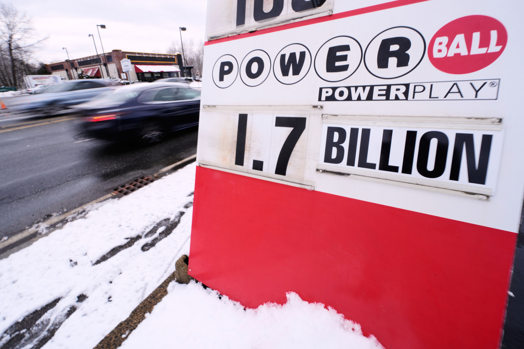 The jackpot for the Powerball lottery game is displayed outside Ted's State Line Mobil station, Wednesday, Dec. 24, 2025, in Methuen, Mass. (AP Photo/Charles Krupa)