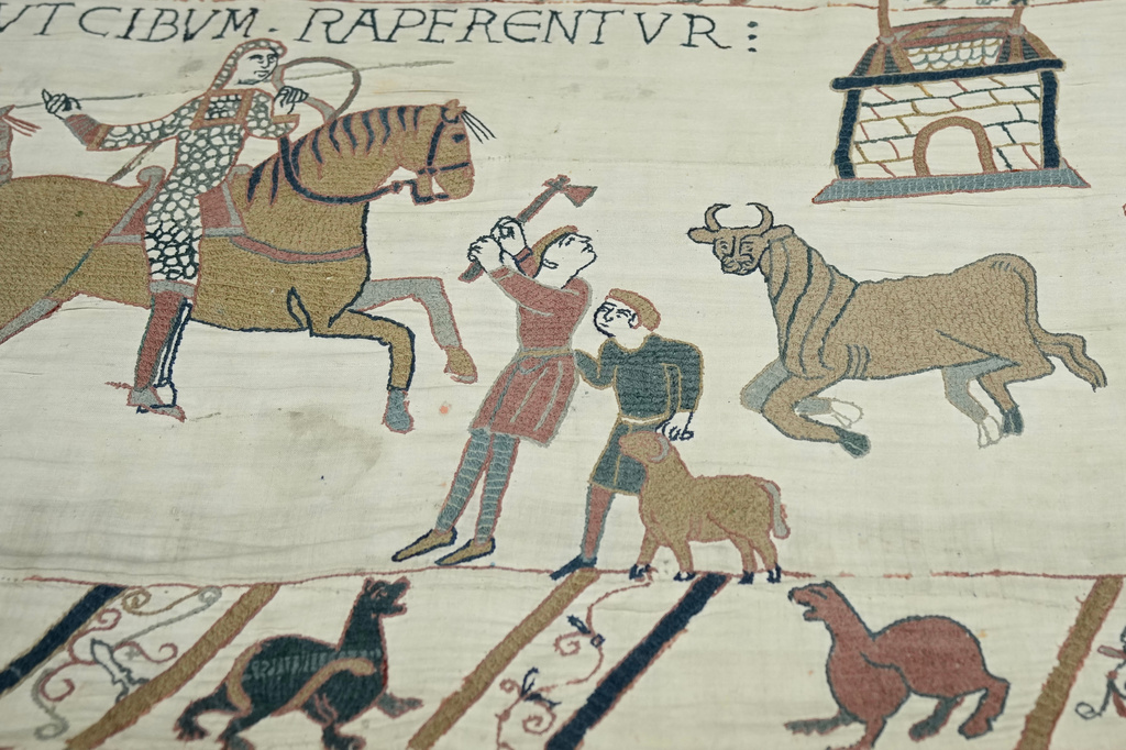 The 70-meter-long Bayeux Tapestry is displayed during a press preview at the British Museum in London after returning to England, following a historic agreement between the UK and France, Monday, Sept. 7, 2026. (AP Photo/Kin Cheung)