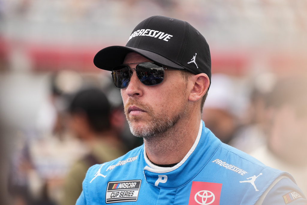 FILE - Denny Hamlin looks on prior to a NASCAR Cup Series auto race at Charlotte Motor Speedway, Sunday, Oct. 5, 2025, in Concord, N.C. (AP Photo/Matt Kelley, File)