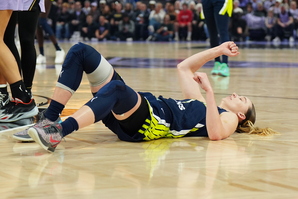 Dallas Wings guard Paige Bueckers reacts on the court after being fouled in the first half of a WNBA basketball first-round playoff game against the Golden State Valkyries Sunday, Sept. 27, 2026, in San Francisco. (AP Photo/Alan Greth)