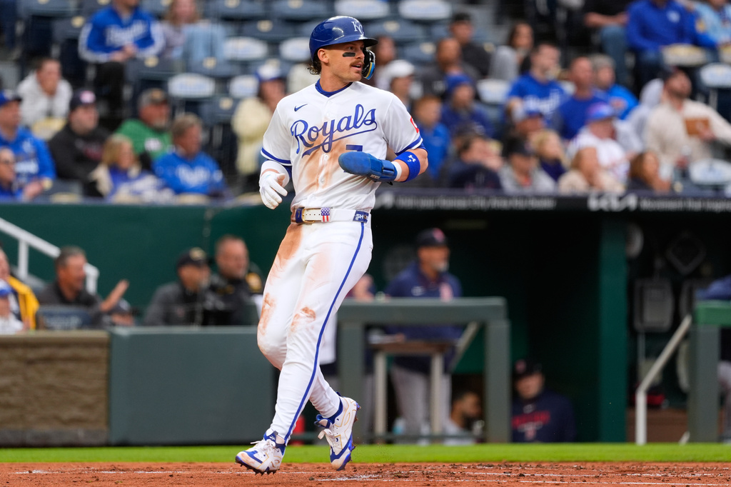 Kansas City Royals' Bobby Witt Jr. runs home to score on a double by Lane Thomas during the first inning of a baseball game against the Boston Red Sox, Tuesday, May 19, 2026, in Kansas City, Mo. (AP Photo/Charlie Riedel)