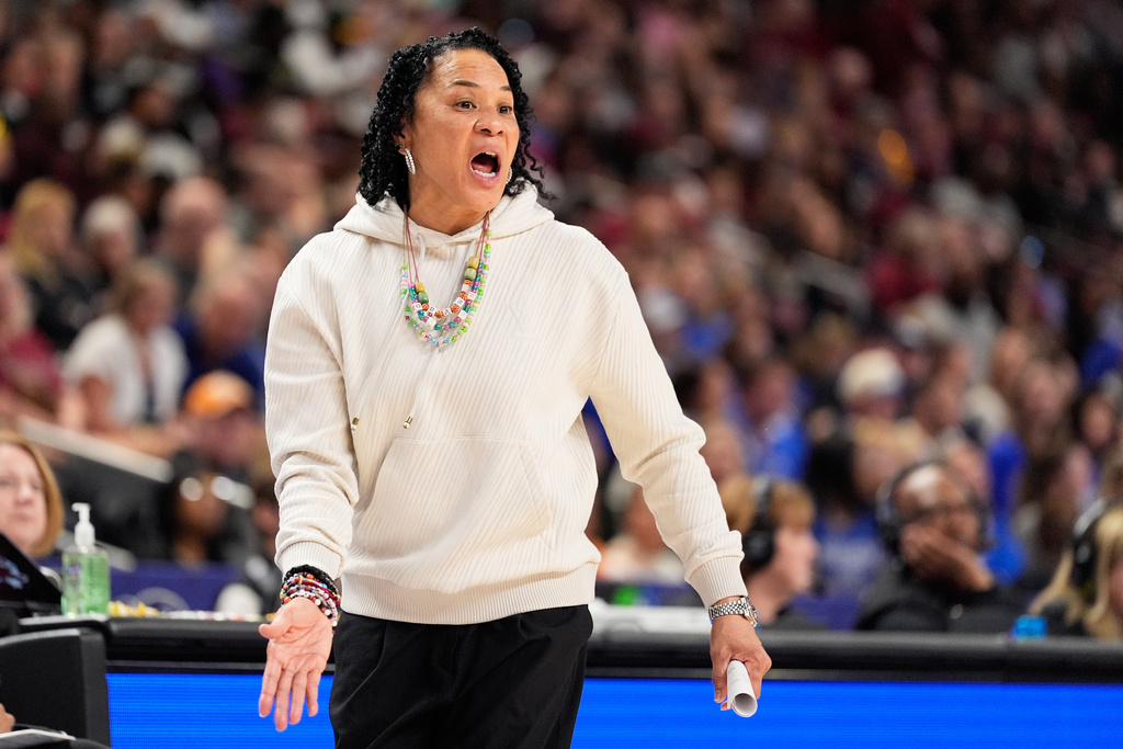 South Carolina head coach Dawn Staley watchers during second half of an NCAA college basketball game against Kentuck in the quarterfinals of the Southeastern Conference tournament, Friday, March 6, 2026, in Greenville, S.C. (AP Photo/Chris Carlson)