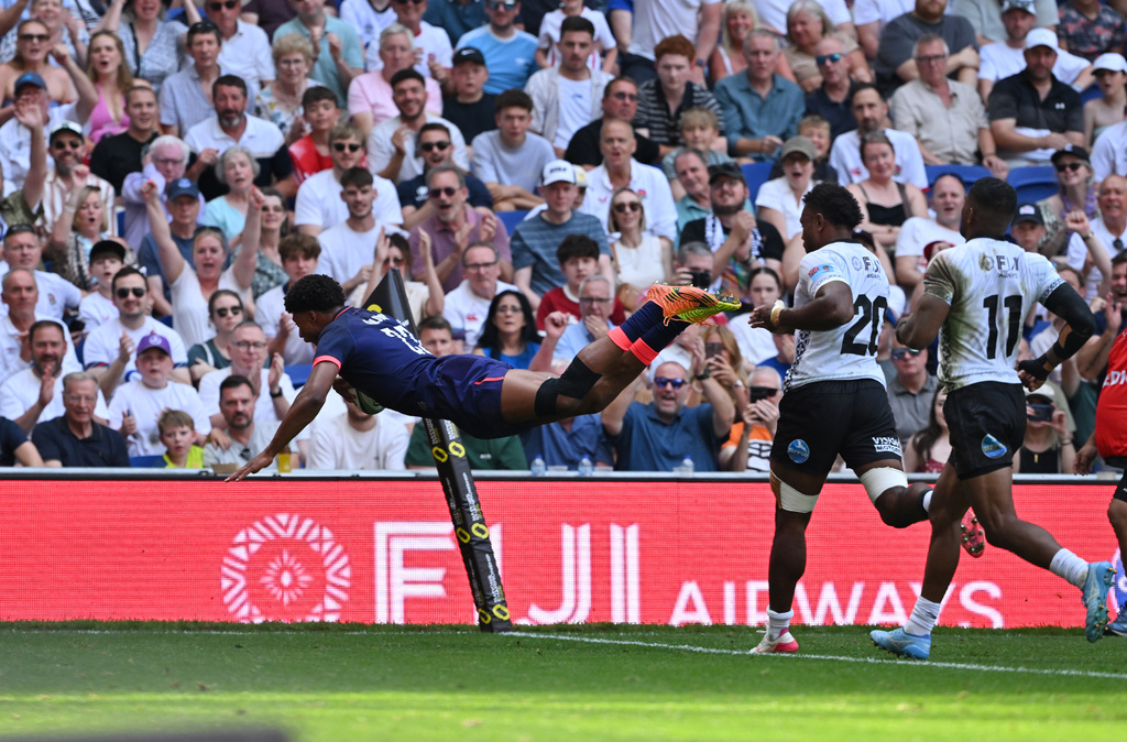 England's Noah Caluori scores a try during the Nations Championship rugby match between England and Fiji in Liverpool, England, Saturday, July 11, 2026. (Bruce Rollinson/PA via AP)