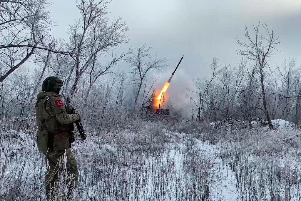 In this image made from video provided by Russian Defense Ministry Press Service on Wednesday, Feb. 4, 2026, Russian Multiple rocket launcher TOS-1A fires towards Ukrainian positions on an undisclosed location in Ukraine. (Russian Defense Ministry Press Service via AP)