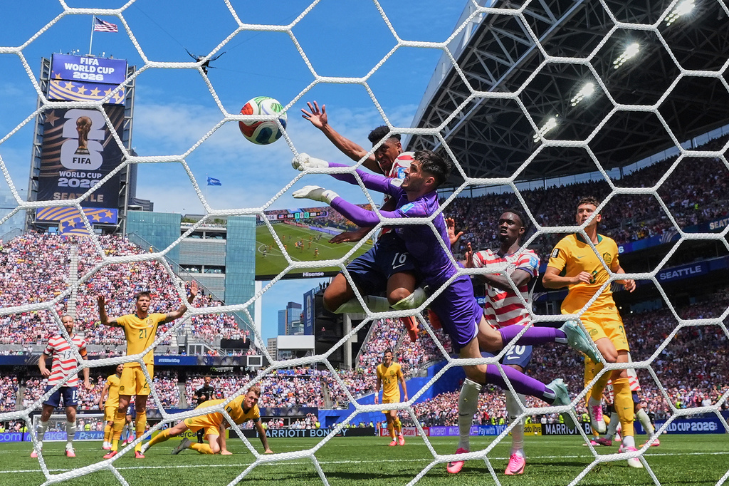 United States' Alex Freeman (16) scores their second goal against Australia goalkeeper Patrick Beach during the World Cup Group D soccer match between the United States and Australia in Seattle, Friday, June 19, 2026. (AP Photo/Lindsey Wasson)