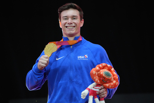 Gold medal winner, Brody Malone of the United States, poses on the podium after competing in the men's horizontal bar final during the 53rd Artistic Gymnastics World Championships in Jakarta, Indonesia, Saturday, Oct. 25, 2025. (AP Photo/Achmad Ibrahim) Gold medal winner, Brody Malone of the United States, poses on the podium after competing in the men's horizontal bar final during the 53rd Artistic Gymnastics World Championships in Jakarta, Indonesia, Saturday, Oct. 25, 2025. (AP Photo/Achmad Ibrahim)