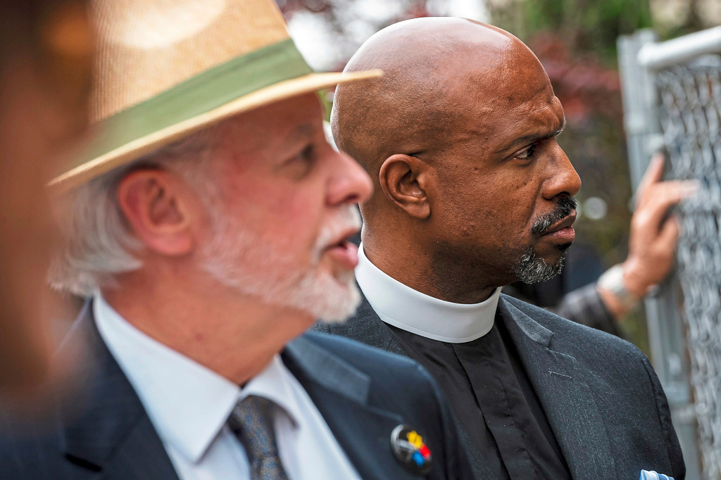 FILE - Rabbi Jeffrey Myers, of Pittsburgh's Tree of Life Congregation, left, speaks about the memorial for the victims of the Tree of Life Synagogue mass shooting accompanied by Pastor Eric Manning, of Emanuel AME Church of Charleston, S. C., during a special prayer service with survivors and relatives of the Emanuel AME Church mass shooting in 2015 and Tree of Life Synagogue mass shooting in 2018, Friday, May 3, 2019, at the Tree of Life Synagogue in Pittsburgh. (Michael M. Santiago/Pittsburgh Post-Gazette via AP, File)