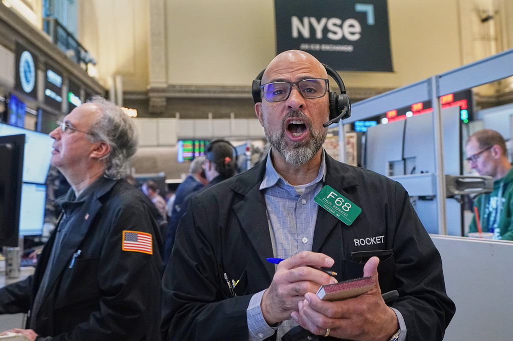 Options trader Steven Rodriguez, center, works on the floor of the New York Stock Exchange, Monday, May 11, 2026. (AP Photo/Richard Drew)
